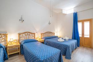 Ένα ή περισσότερα κρεβάτια σε δωμάτιο στο Brezza Apartment Near The Sea - Happy Rentals