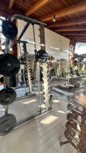 a room with a gym with military equipment on display at teste Casa na areia da praia Peninsula de Maraú in Marau