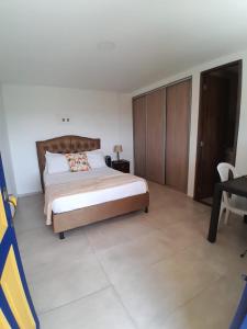 Postel nebo postele na pokoji v ubytování Ecohotel Guaduales Nature