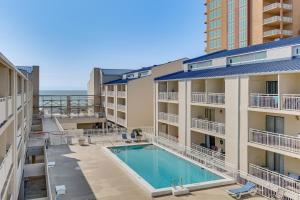 an image of a swimming pool in a apartment building at Orange Beach Retreat with 4 Pools - Walk to Beach! in Gulf Shores