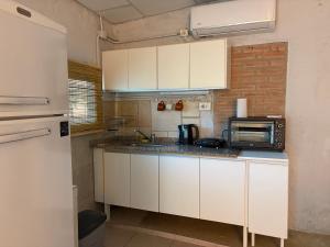 Η κουζίνα ή μικρή κουζίνα στο Cardozo House Monoambiente acogedor y familiar