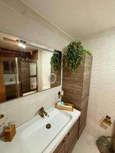 a bathroom with a sink and a mirror at El Nido de Mijas in La Cala de Mijas