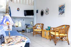 a living room with two chairs and a table at Seaview 180 in Skala Fourkas