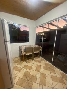 a room with a bench in a room with windows at Casa da Vica in São Gabriel