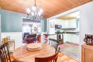 a kitchen and dining room with a wooden ceiling at Pet-Friendly Pequot Lakes Vacation Rental Cabin! in Pequot Lakes +20 photos