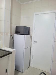 Η κουζίνα ή μικρή κουζίνα στο Loft canal 5 Vista Mar l wi fi l ar cond +3 φωτογραφίες