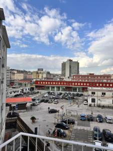 a parking lot with cars parked in a city at La dolce vita Napoli in Naples