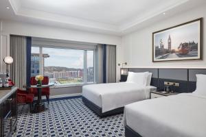 Voodi või voodid majutusasutuse Londoner Grand, a Luxury Collection Hotel, Macau toas