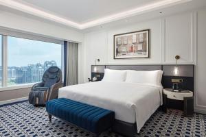 Voodi või voodid majutusasutuse Londoner Grand, a Luxury Collection Hotel, Macau toas