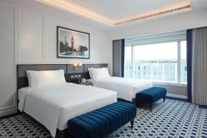 Voodi või voodid majutusasutuse Londoner Grand, a Luxury Collection Hotel, Macau toas