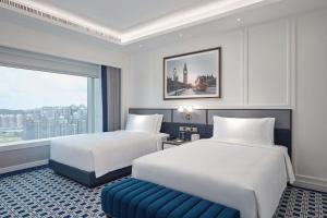 Voodi või voodid majutusasutuse Londoner Grand, a Luxury Collection Hotel, Macau toas
