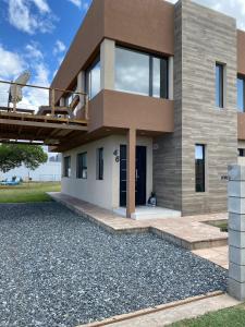 a modern house with a bridge over a driveway at Luna & Playa in Playa Dorada