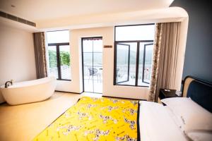 Llit o llits en una habitació de Xiyuyanyiyu B&B