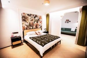 Llit o llits en una habitació de Xiyuyanyiyu B&B