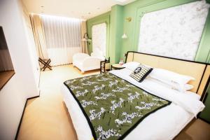 Llit o llits en una habitació de Xiyuyanyiyu B&B