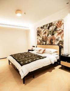 Llit o llits en una habitació de Xiyuyanyiyu B&B