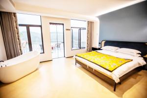 Llit o llits en una habitació de Xiyuyanyiyu B&B
