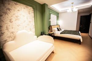 Llit o llits en una habitació de Xiyuyanyiyu B&B
