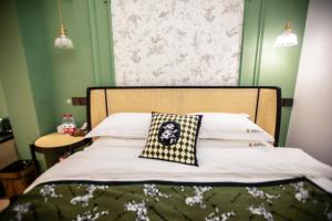 Llit o llits en una habitació de Xiyuyanyiyu B&B