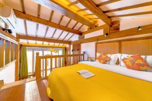 Ένα ή περισσότερα κρεβάτια σε δωμάτιο στο Quiet Garden Inn Lijiang Old Town Branch