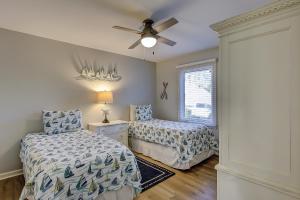 a bedroom with two beds and a ceiling fan at Wonderful luxury condo with great golf views K Bed Beach gear & bike rentals in Hilton Head Island +19 photos