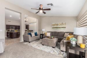 a living room with a couch and a table at Baylor Gilbert in Gilbert