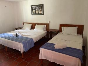 Hotel Davilejas客房内的一张或多张床位