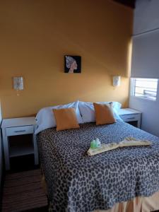 a bedroom with a bed with a tray on it at Claro de luz in Federación