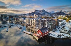 an aerial view of a city with a harbor at Central City Apartment in Svolvær