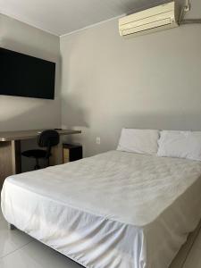 Ένα ή περισσότερα κρεβάτια σε δωμάτιο στο Quarto 1 Viajante