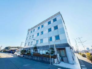 a large building on the side of a street at Hotel Areaone Naruto in Naruto