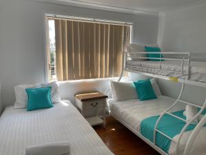 Postel nebo postele na pokoji v ubytování Fishing Haven Holiday Park