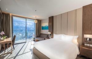 Wins House - Suite Panorama Grand客房内的一张或多张床位