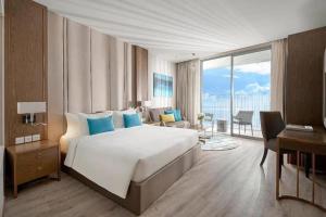 Wins House - Suite Panorama Grand客房内的一张或多张床位