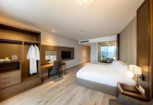 Wins House - Suite Panorama Grand客房内的一张或多张床位