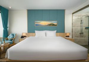 Wins House - Suite Panorama Grand客房内的一张或多张床位