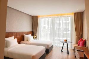 Wins House - Suite Panorama Grand客房内的一张或多张床位