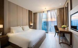 Wins House - Suite Panorama Grand客房内的一张或多张床位
