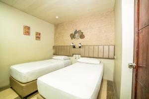 Кровать или кровати в номере Level 007 Hotels and Resorts Inc +7 фотографий