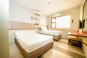 Кровать или кровати в номере Level 007 Hotels and Resorts Inc