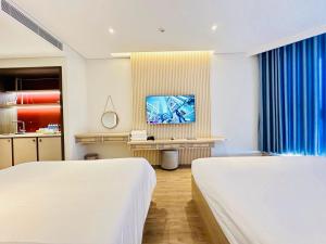 Khách Sạn Wins Apec Mũi Né客房内的一张或多张床位