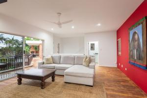 a living room with a couch and a table at The Hideaway at 88 in Ballito