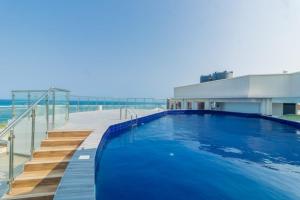 a swimming pool on top of a building at Antalyia Luxury Apartments Nyali in Mombasa