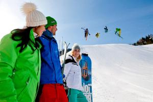 a group of people standing in the snow at Gästehaus Biobauernhof Mandl in Murau +107 photos