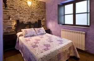Postel nebo postele na pokoji v ubytování Hostal Raices