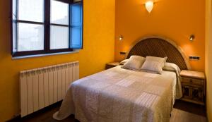 Postel nebo postele na pokoji v ubytování Hostal Raices
