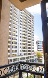 a view of a large building from a balcony at Luxury Two Bedroom Master & Suite Apartment in Nairobi