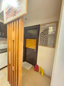 a small room with a door and some puppets at Steff's Condo 1708 one bedroom at Centrio Tower in Cagayan de Oro +3 photos