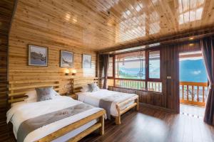 Postel nebo postele na pokoji v ubytování Longji Yijingyuan Hotel