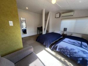 Postel nebo postele na pokoji v ubytování Assi House
